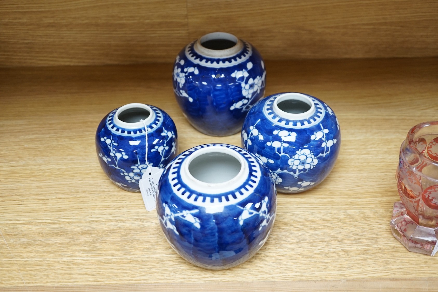 Four Chinese blue and white ‘prunus’ jars, tallest 14cms high